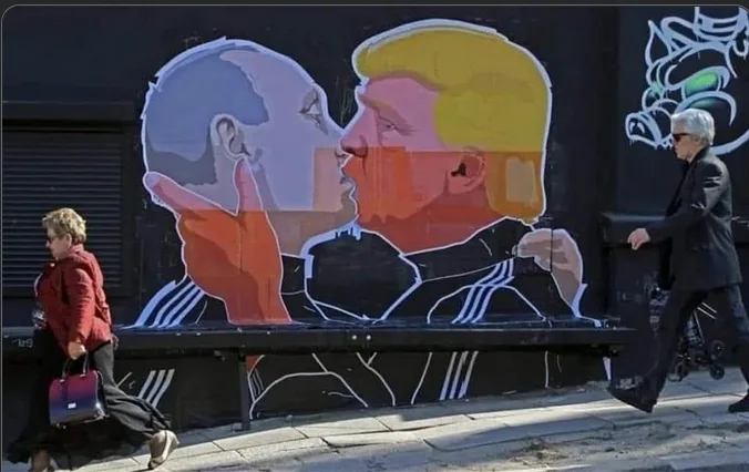 A street mural depicts stylized portraits of Barack Obama and Donald Trump in a close, affectionate pose, appearing to kiss…