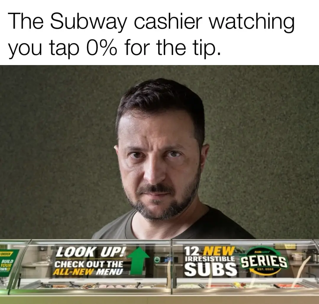 A man with a stern, disapproving expression is shown behind a Subway sandwich counter. The overlaid text reads 'The Subway…