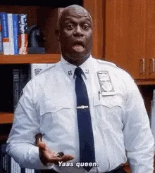 Six frames show a Black man in a light blue police uniform with a dark tie, standing in front of wooden bookshelves. He…