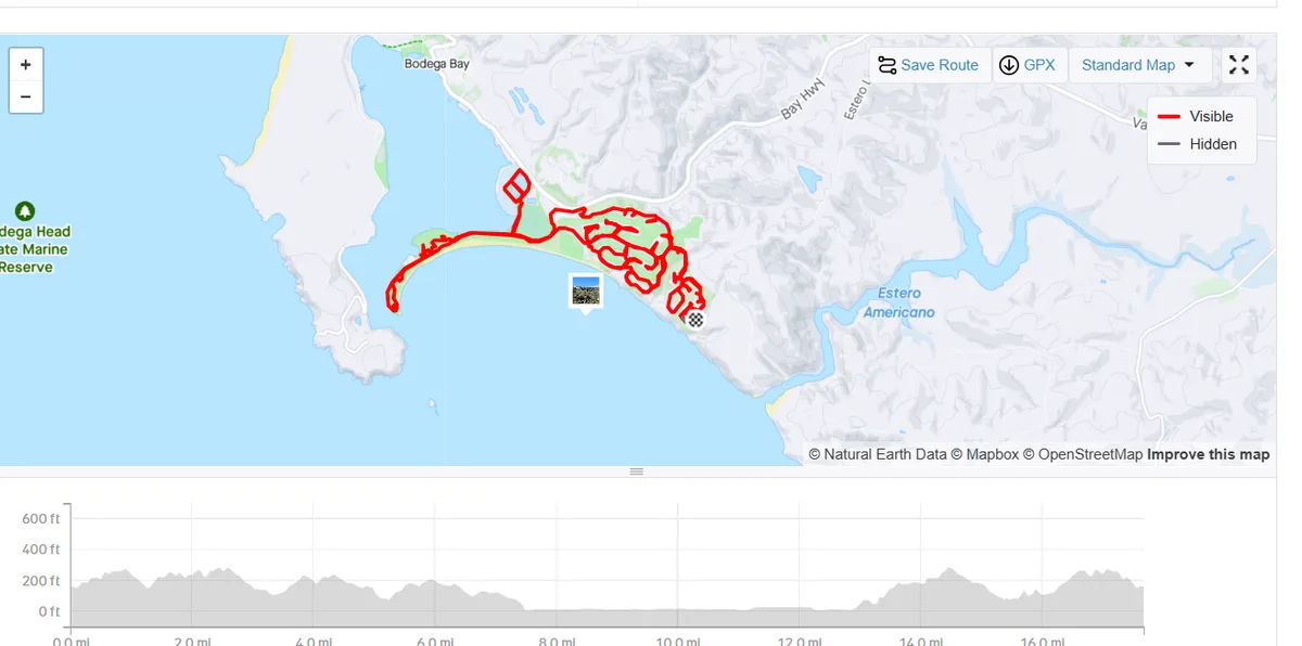 a map view of a coastal route in California, with a red line tracing a long, winding path along the shore from Bodega Bay to…