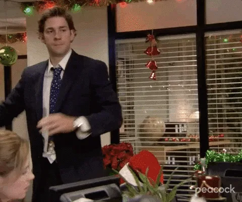 A six-panel sequence from 'The Office' shows Jim Halpert (in a suit) throwing a snowball at Dwight Schrute (in a suit and…