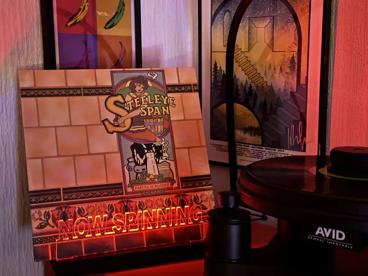 A vinyl record player with an 'AVID SEQUEL TURNTABLE' is shown next to a custom album cover for 'STEELEYE SPAN' titled…