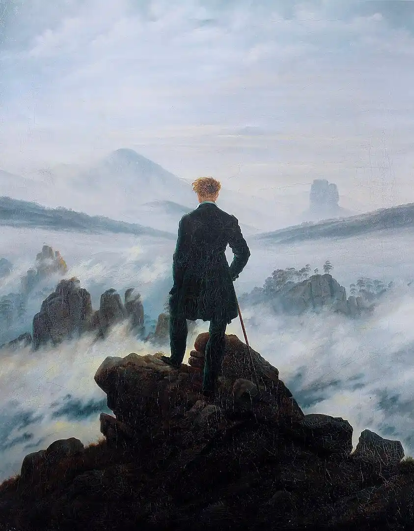 A man in a dark coat stands atop a rocky peak, gazing out over a vast, misty valley with distant mountains. The overlaid…