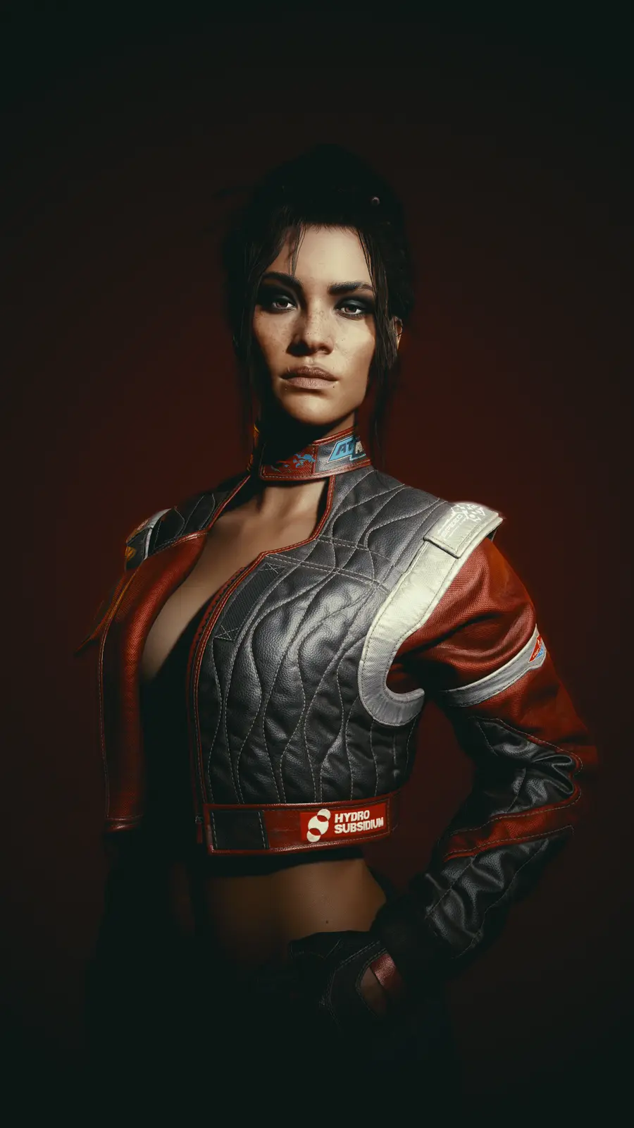 A woman in a red and black racing-style leather jacket with a 'HYDRO SUBSIDIUM' logo on the waistband, standing confidently…