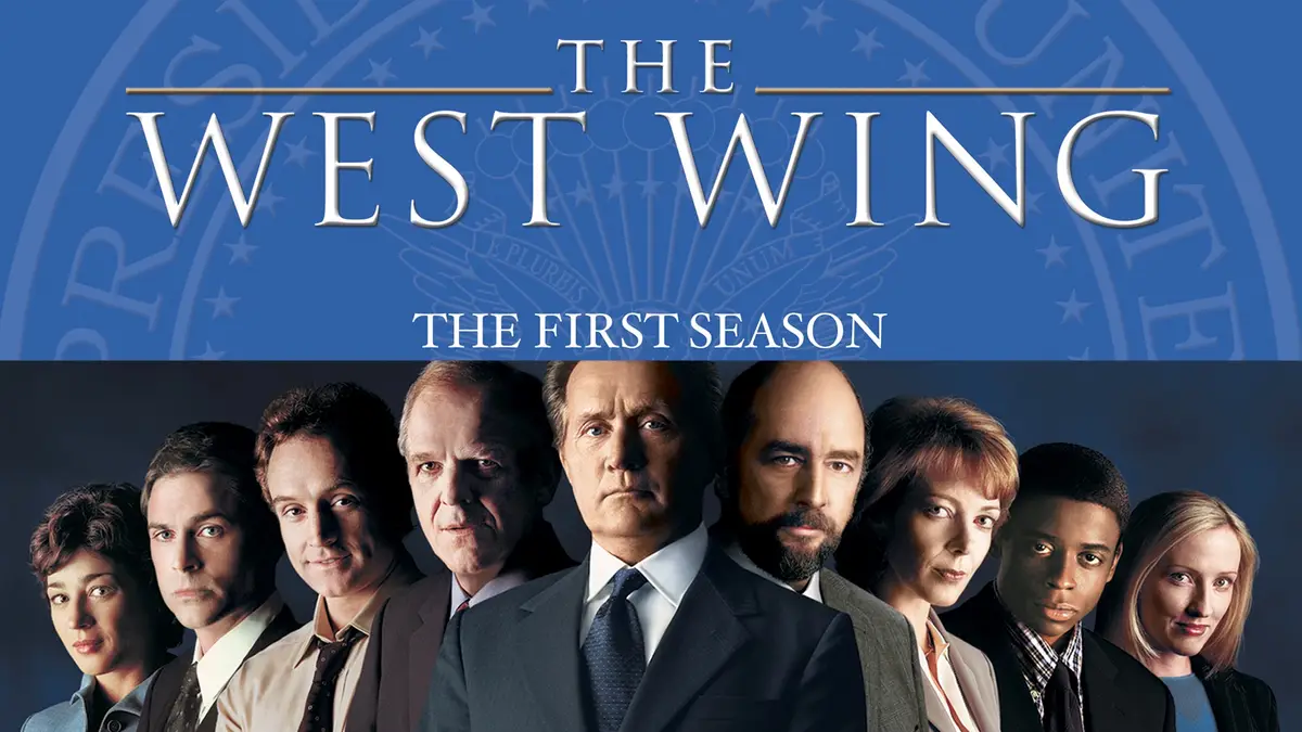 The image is a promotional poster for 'The West Wing: The First Season,' featuring a lineup of nine cast members in formal…