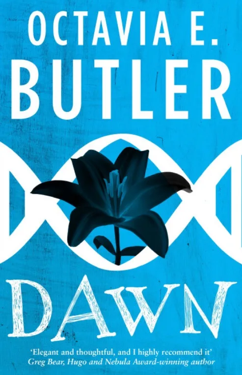 The image is the book cover for 'Dawn' by Octavia E. Butler, featuring a black lily centered within a white DNA double helix…