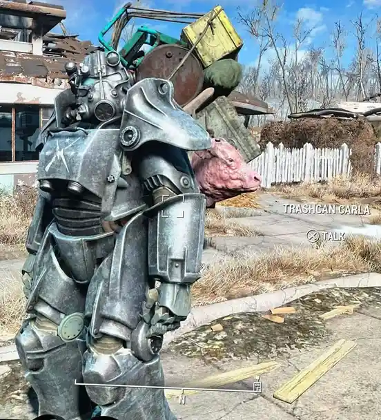 A screenshot from the video game Fallout 4 shows a player character in power armor standing next to a pink pig-like creature…