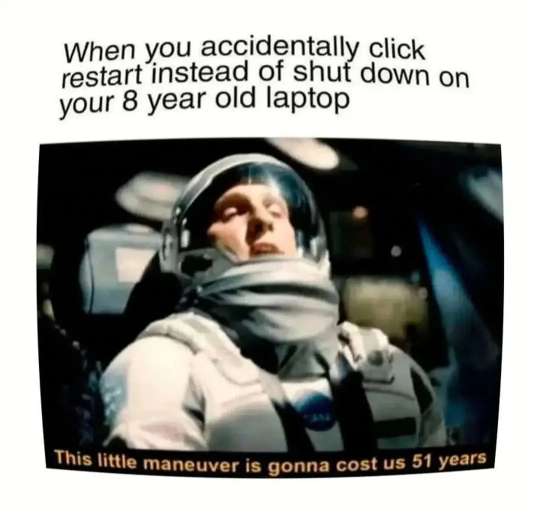 An astronaut in a white spacesuit with a NASA patch looks exhausted and resigned, seated in a spacecraft cockpit. The image…