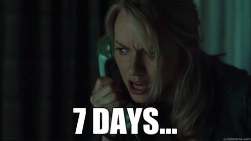 A woman with blonde hair is shown in a dimly lit room, holding a phone receiver to her ear with a terrified and frantic…