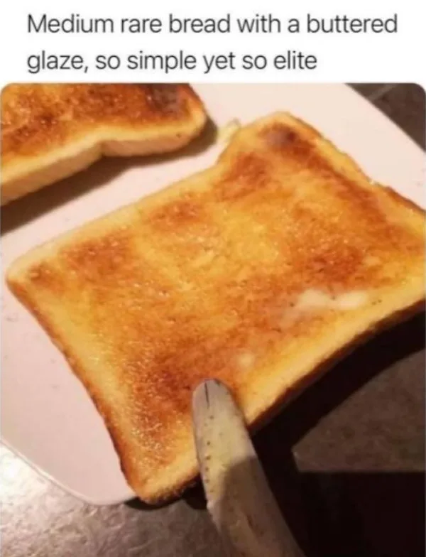 A close-up photo shows a slice of toast with golden-brown, slightly charred edges and a visible buttery glaze on top…