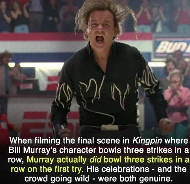 A still from the movie 'Kingpin' shows Bill Murray with wild hair and an ecstatic, open-mouthed expression, wearing a black…