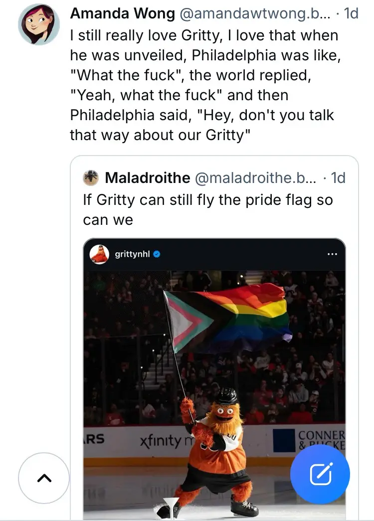 An image of the Philadelphia Flyers' mascot Gritty, an orange furry creature in a hockey uniform, holding a rainbow pride…