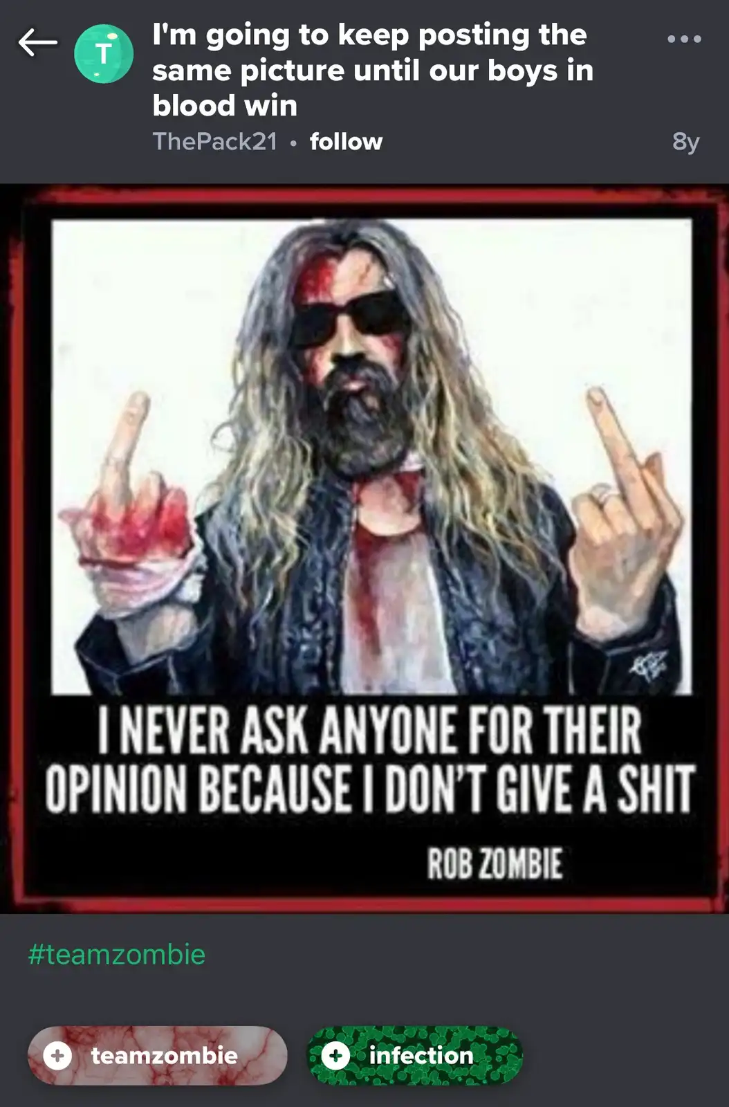 A screenshot of a social media post featuring a meme image of Rob Zombie with blood on his face and hands, making the…