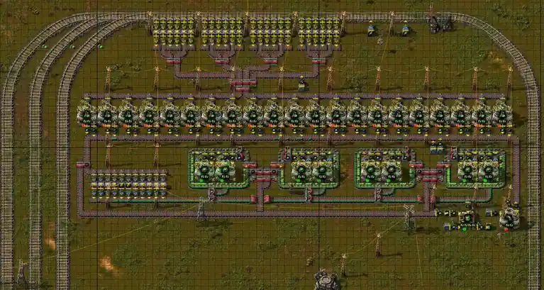 An overhead view of a complex, highly organized factory layout from the game Factorio, featuring numerous conveyor belts…