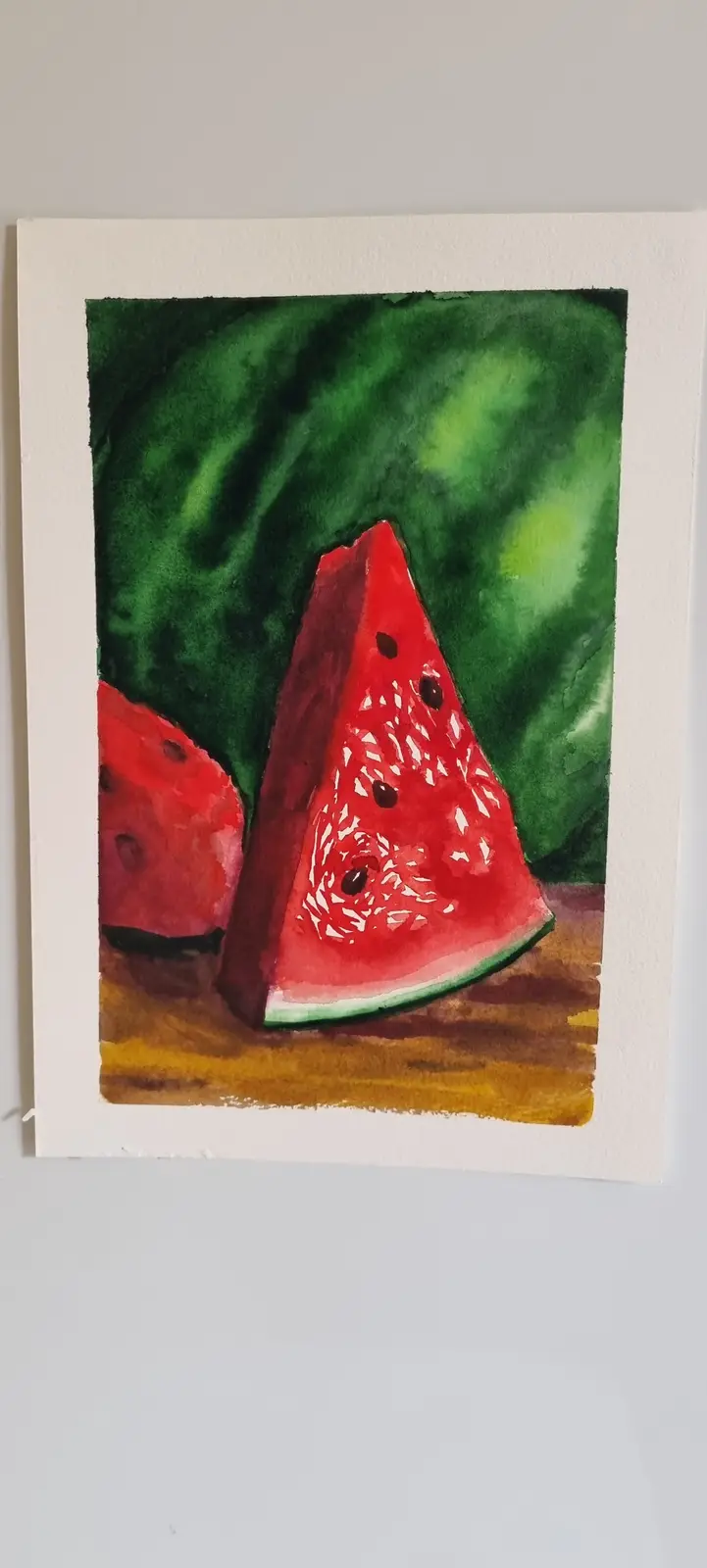 A watercolor painting depicts two slices of watermelon on a wooden surface, with one prominent slice in the foreground and…