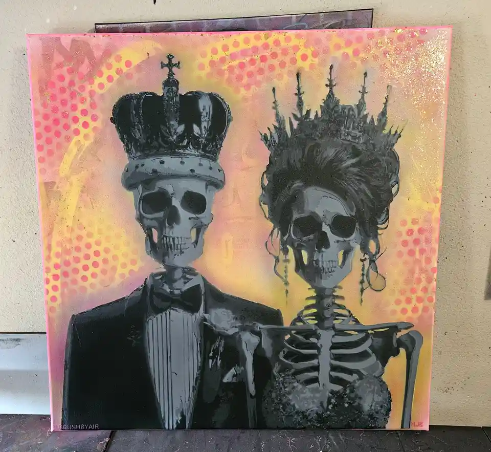 A painting depicts two skeletons dressed as a royal couple, the male in a tuxedo with a crown and the female in a gown with…