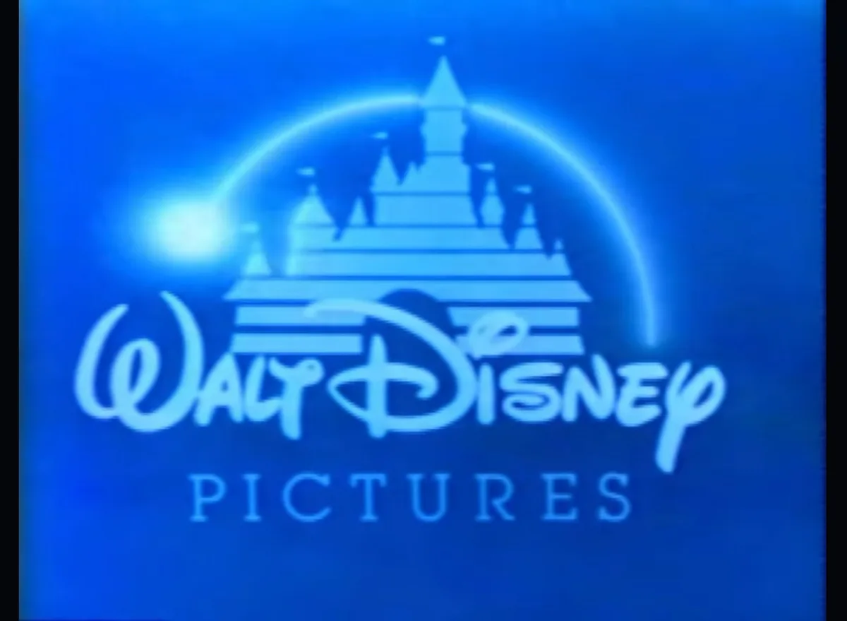 The image displays the classic Walt Disney Pictures logo, featuring a glowing blue silhouette of Cinderella's Castle with a…