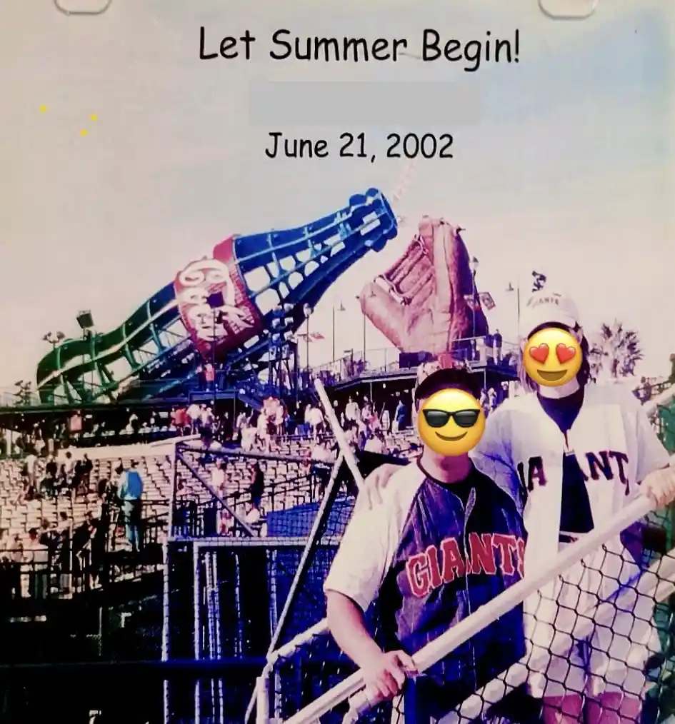 A vintage 2002 photo shows two people in San Francisco Giants baseball jerseys posing in front of the famous AT&T Park (then…