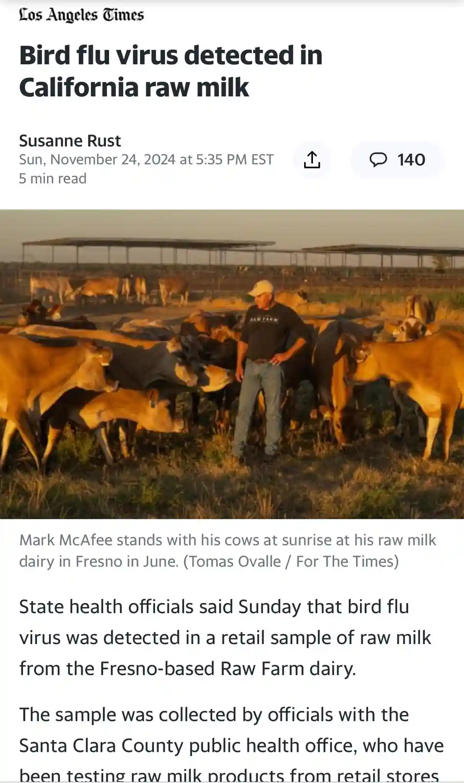 A screenshot of a Los Angeles Times article shows a photo of a man in a black t-shirt and cap standing among a herd of cows…