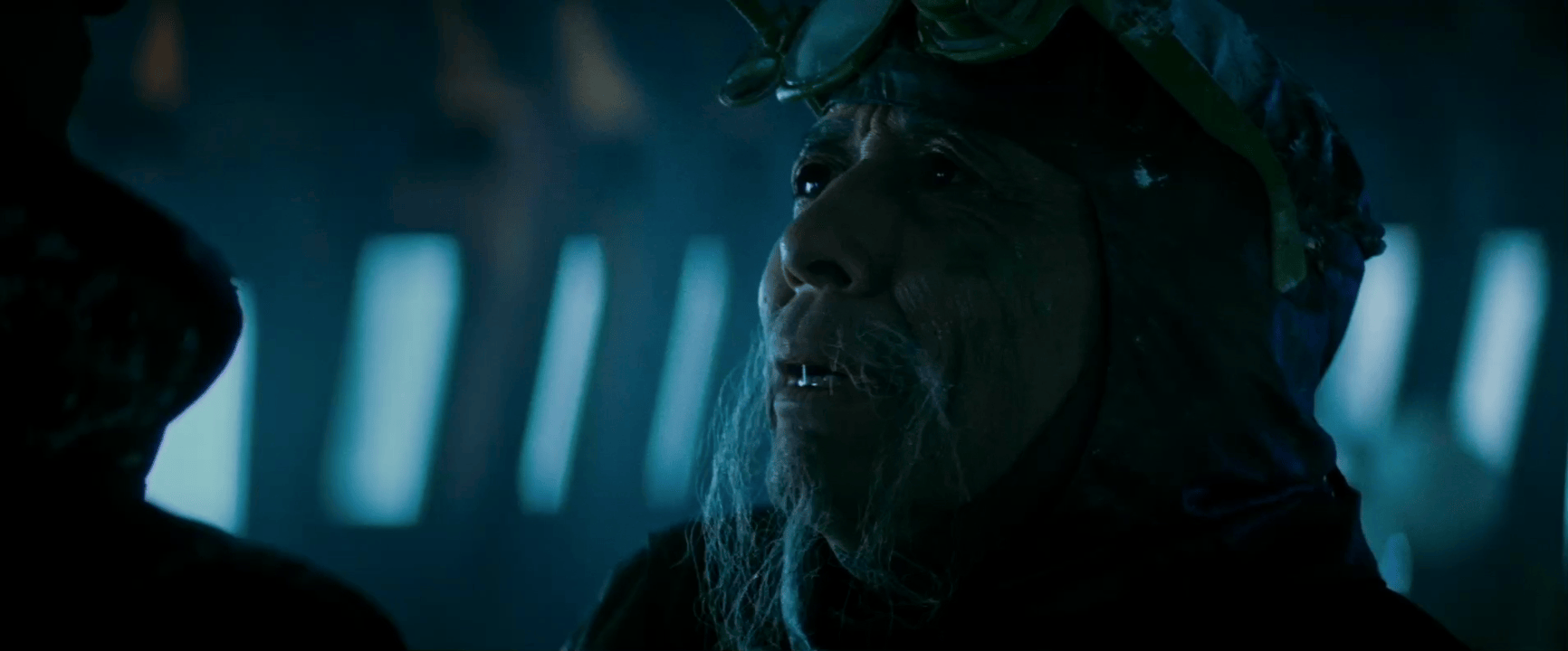 A sequence of frames shows a man with a long beard and goggles, looking upward with a confused or overwhelmed expression…