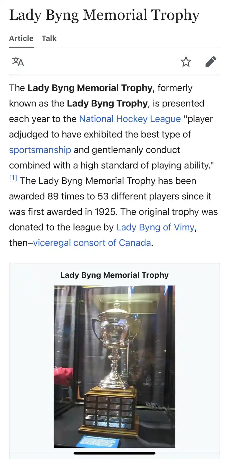 A screenshot of a Wikipedia article about the Lady Byng Memorial Trophy, showing its description text and an image of the…