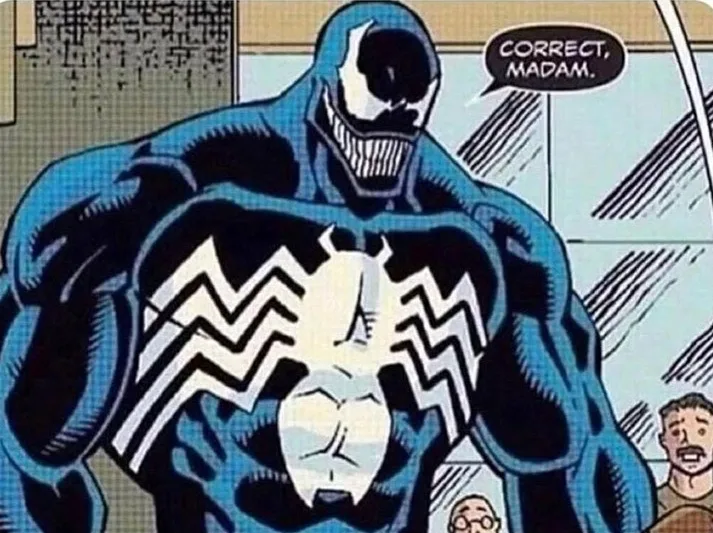 A comic book panel shows the character Venom, a large blue symbiote with a white spider-like chest emblem and a wide toothy…