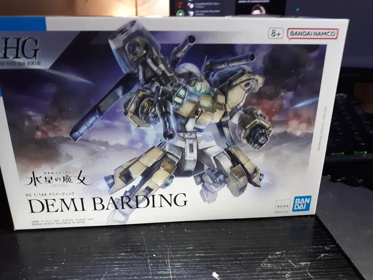 A photo of a Bandai Namco model kit box for the 'HG 1/144 Demi Barding' from 'Mobile Suit Gundam: The Witch from Mercury'…
