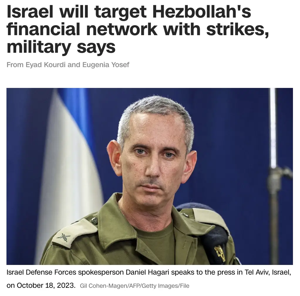 A photo of an Israeli Defense Forces spokesperson, Daniel Hagari, in uniform, speaking at a press conference with an Israeli…