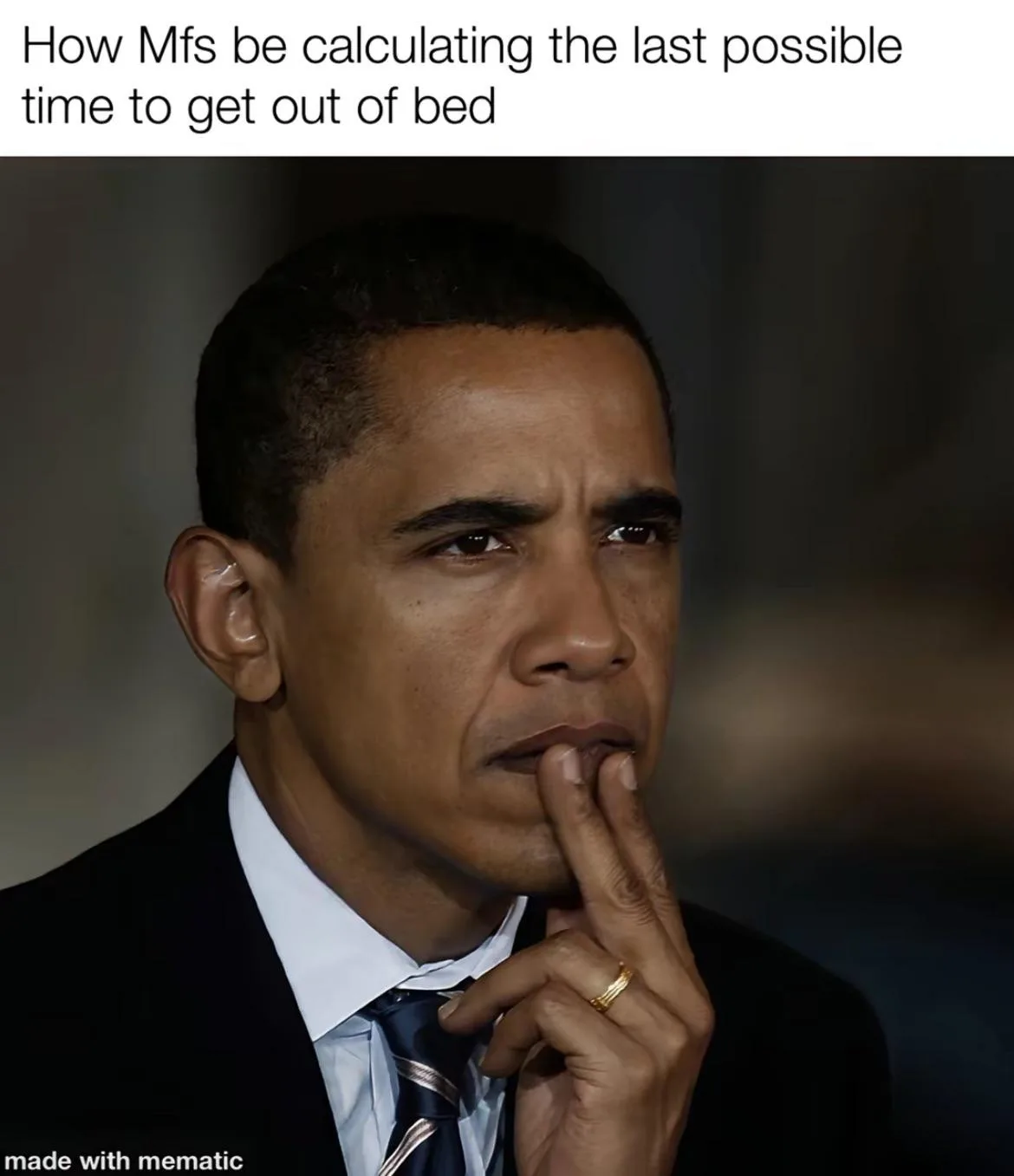 A close-up photo of Barack Obama in a suit and tie, looking intensely thoughtful with his finger on his lips. The overlaid…