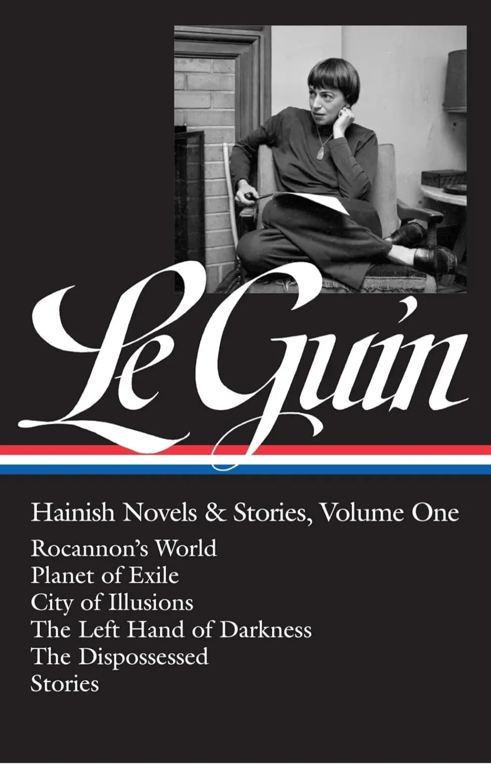 A black-and-white book cover featuring a woman sitting in a chair, holding a pen, with the name 'Le Guin' in large white…