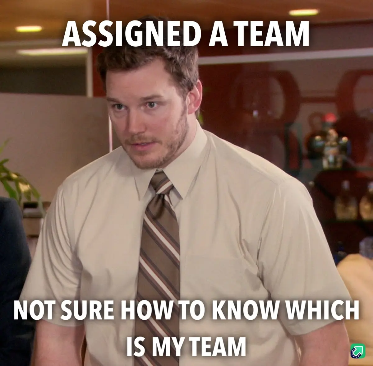 A man in a beige shirt and striped tie looks confused in an office setting. White text overlaid on the image reads 'ASSIGNED…