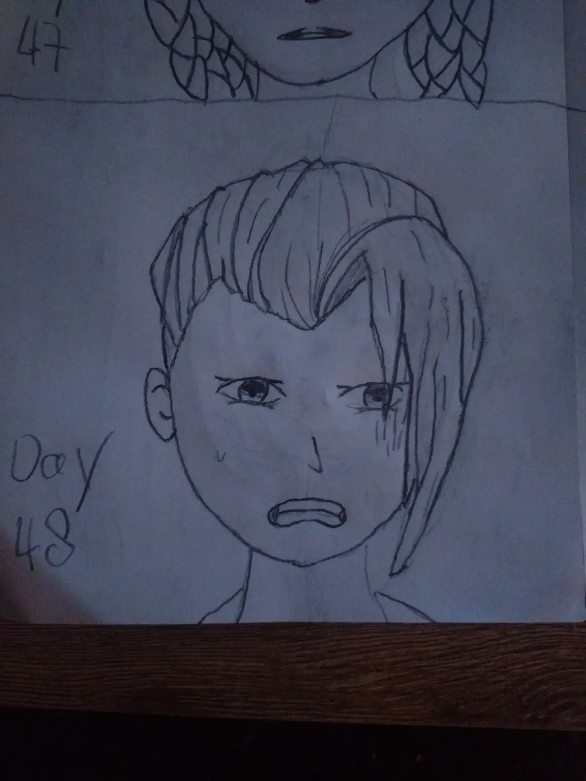 A hand-drawn pencil sketch shows two anime-style character faces on separate lines. The top face has braided hair and a…