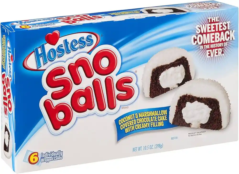 A product box for Hostess Sno Balls, featuring a blue and white design with large red text. Two halves of a round…