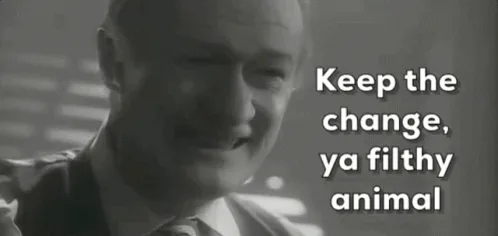 The image displays a black-and-white sequence of three panels showing a man in a suit smiling and speaking. The same text…