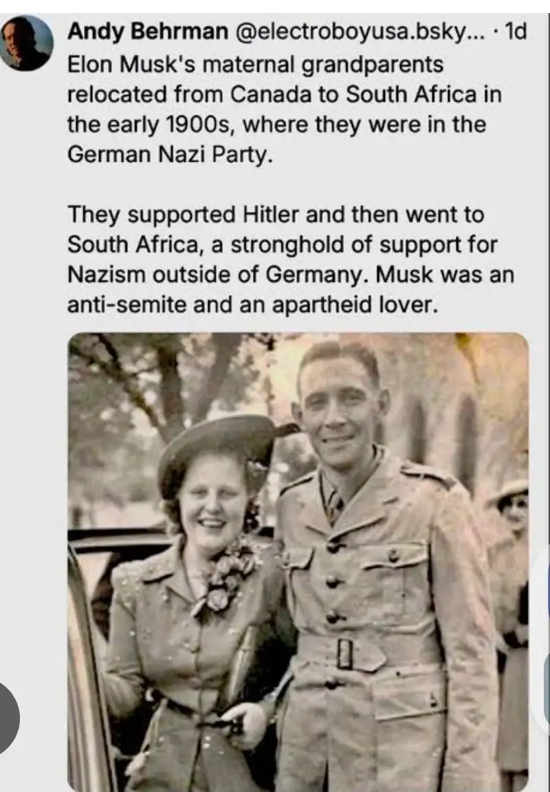 A black-and-white photo shows a smiling man in a military uniform standing beside a smiling woman in a hat and coat…