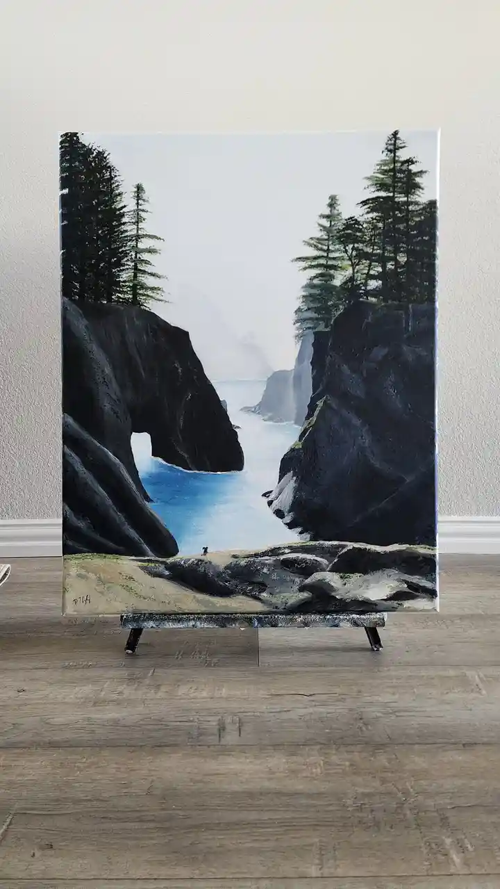 A painting on canvas depicts a dramatic coastal canyon with dark cliffs, evergreen trees, and blue water, with a tiny dog…