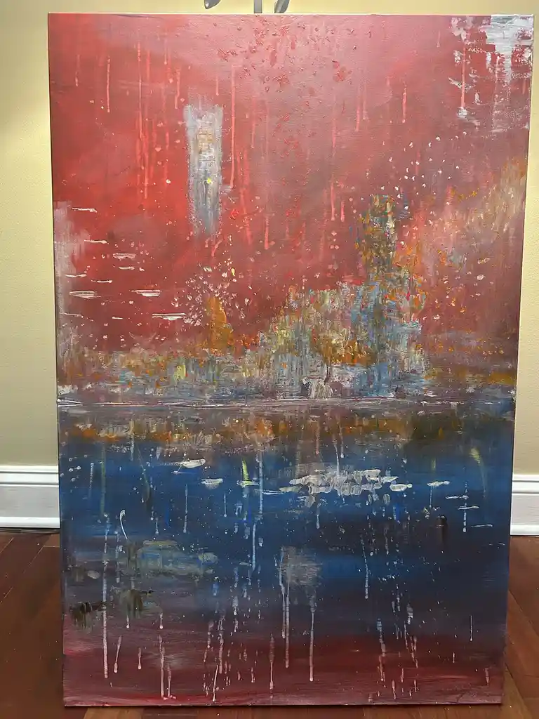 A large abstract painting depicts a city skyline in red and orange tones reflected in a blue body of water, with visible…