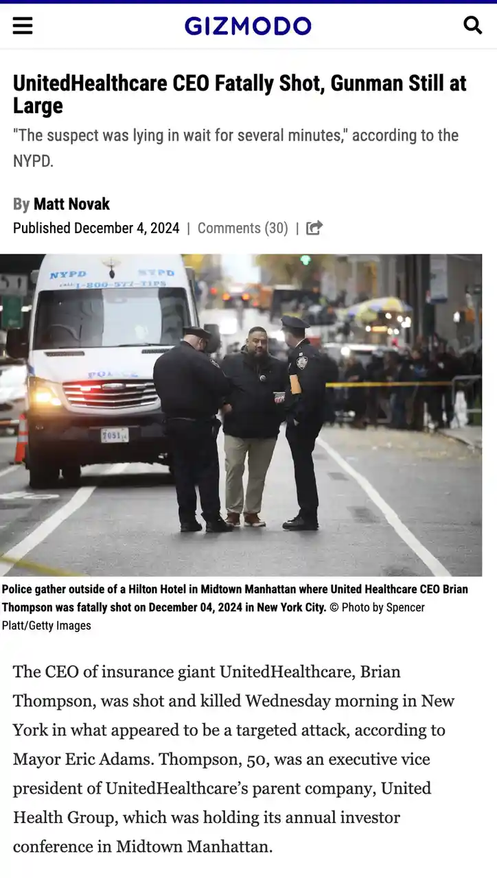 A screenshot of a Gizmodo news article shows a photo of police officers speaking to a man in a black jacket outside a hotel…