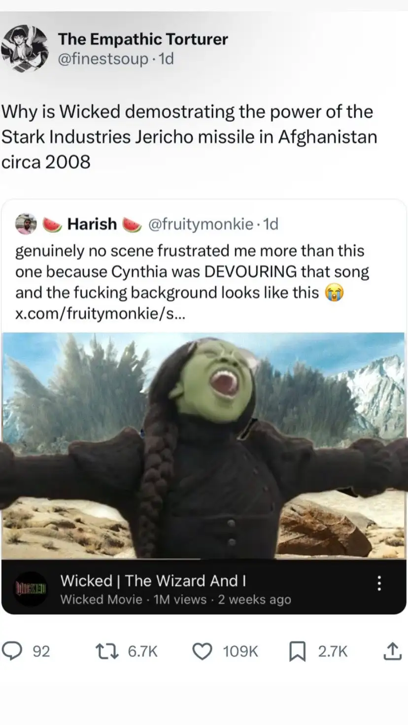 The image shows a screenshot of a tweet thread where one user asks why the movie 'Wicked' depicts a missile test in…