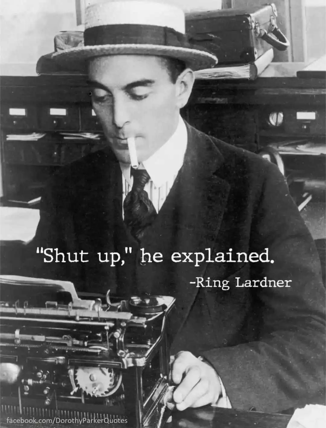 A black-and-white photo shows a man in a suit and bowler hat smoking a cigarette while typing on an old manual typewriter…