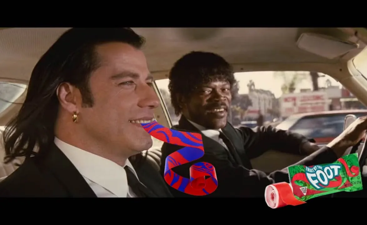 A still from the movie 'The Warriors' shows two men in a car; one has a red and blue swirl candy wrapper digitally pasted…