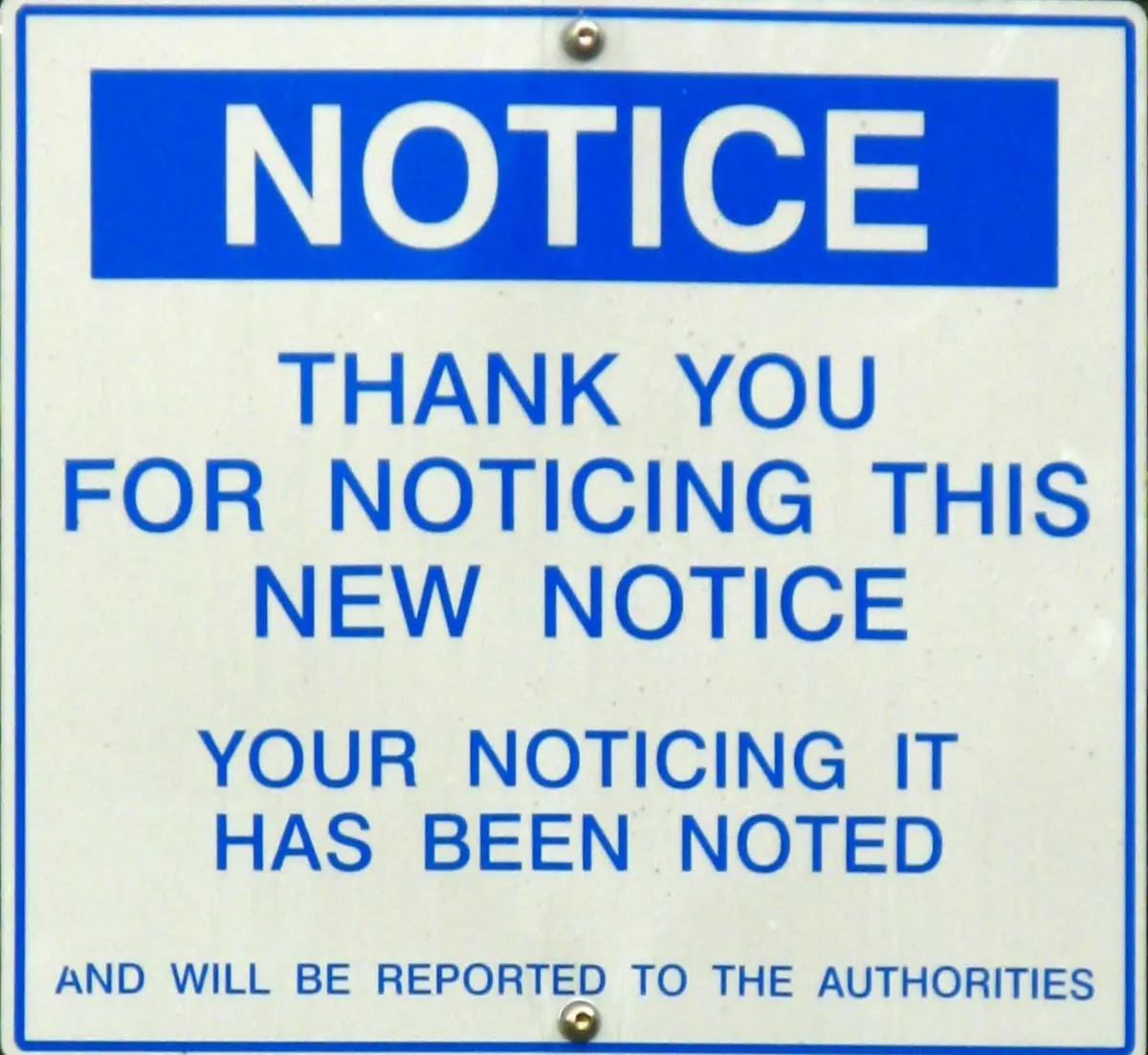 A blue and white official-looking notice sign with bold text that reads 'NOTICE' at the top, followed by 'THANK YOU FOR…