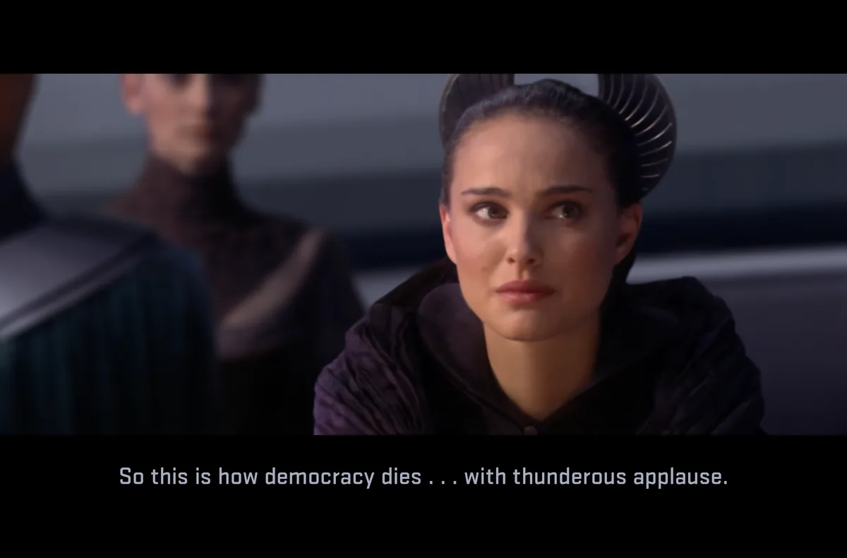A still image from Star Wars: Episode III – Revenge of the Sith shows Padmé Amidala with a shocked and horrified expression…