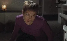 A sequence of six images shows a woman in a purple uniform, initially looking alarmed and leaning over a console, then…