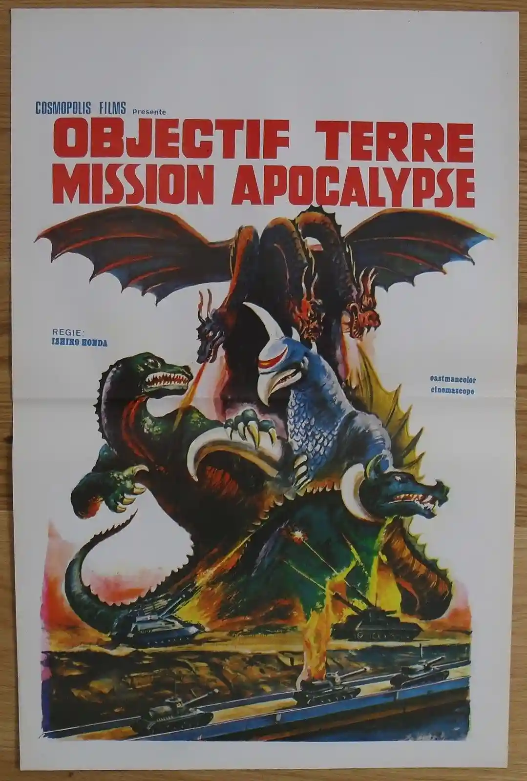 A vintage French movie poster for 'Objectif Terre Mission Apocalypse' (Godzilla vs. King Ghidorah) shows three giant…