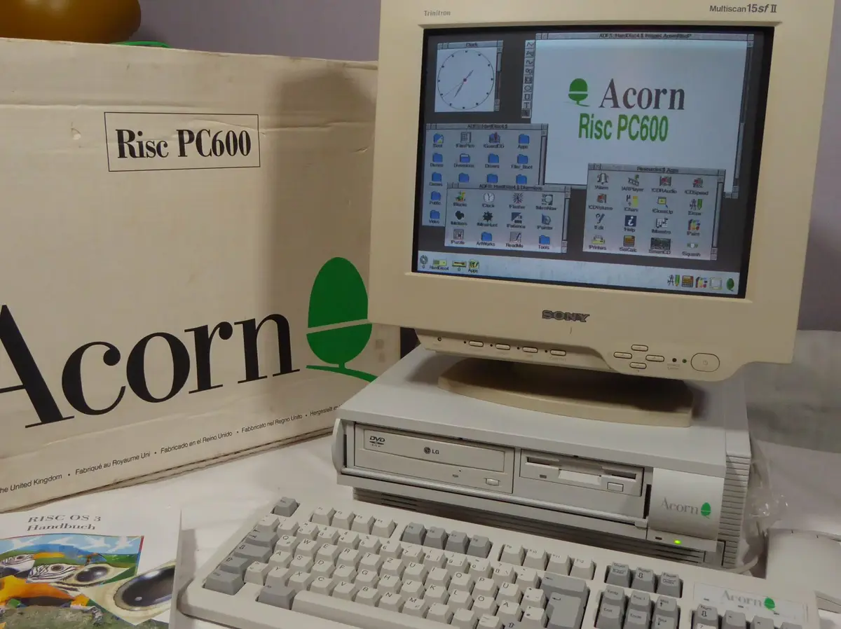 An Acorn Risc PC600 computer with a Sony Trinitron monitor displays the RISC OS 3 desktop with multiple windows and icons…