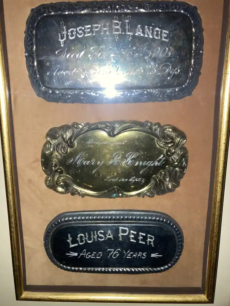 A framed display of three ornate, vintage memorial plaques for Joseph B. Lance, Mary Bolknight, and Louisa Peer, each…