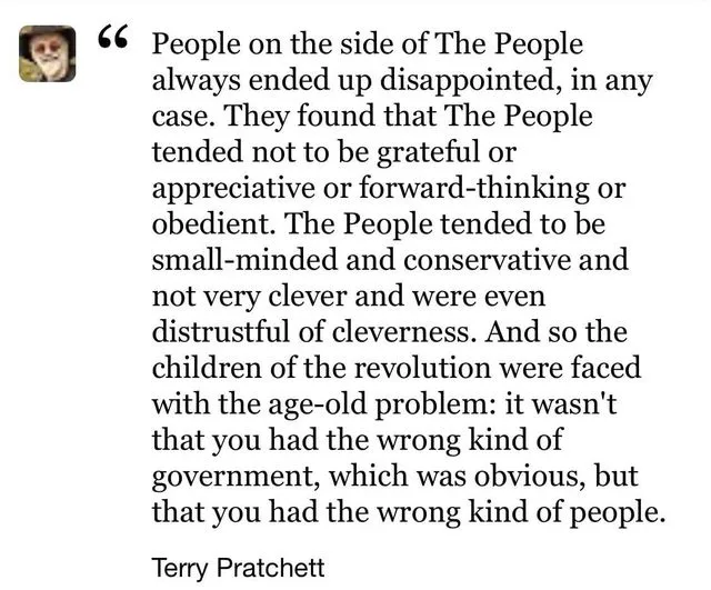 A white background image displays a long quote in black serif font attributed to Terry Pratchett. The quote critiques 'The…