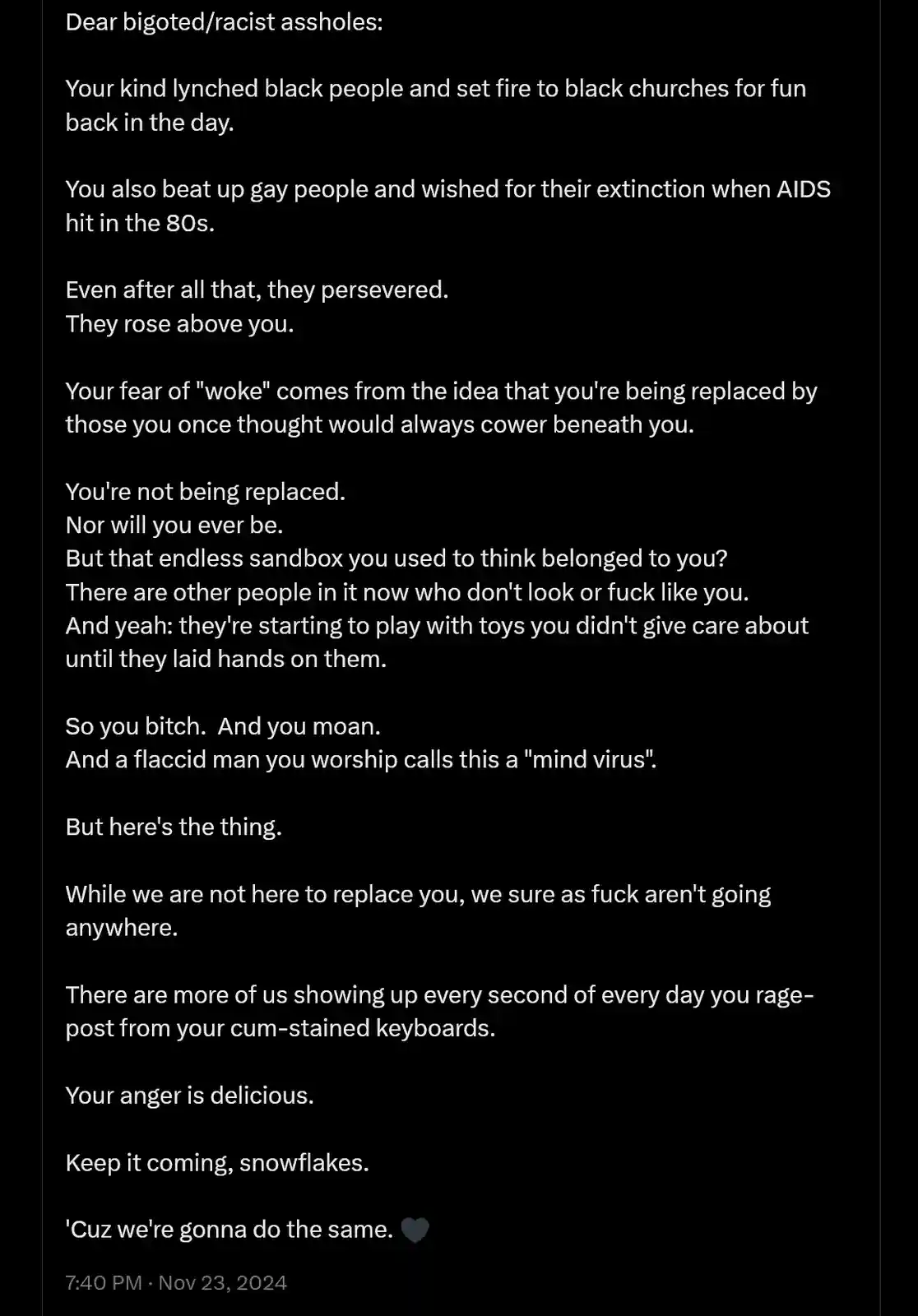 A black background with white text displays a lengthy, confrontational message addressed to 'bigoted/racist assholes,'…