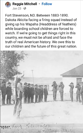 A historical black-and-white photograph shows a man standing before a line of soldiers holding rifles, with a group of…